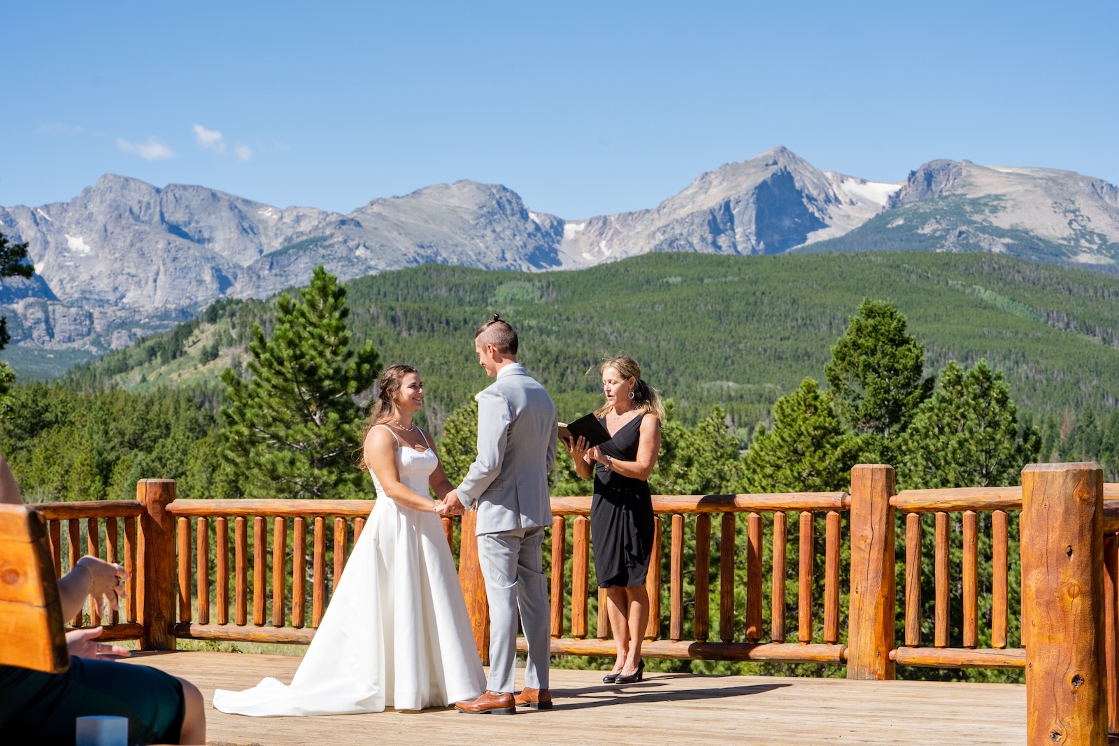 Wendee leading a personalized wedding ceremony script for a couple in the Colorado mountains